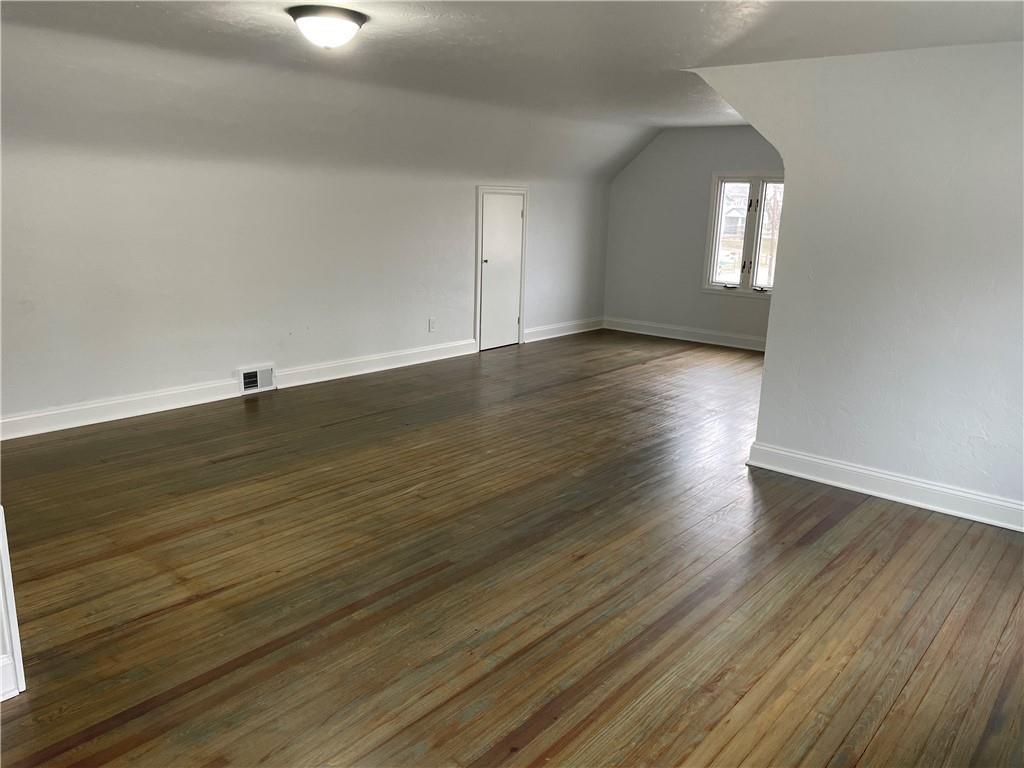 816 High Street Hiller, PA 15444 - Photo 12 of 21 an empty room with wooden floor and windows