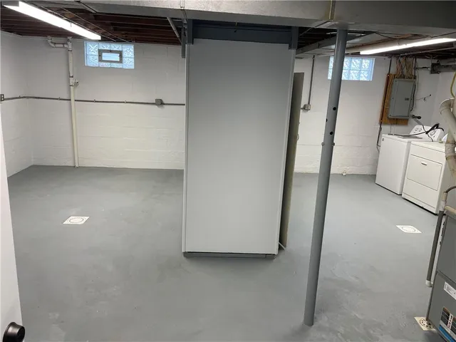 a view of storage and utility room with washer and dryer