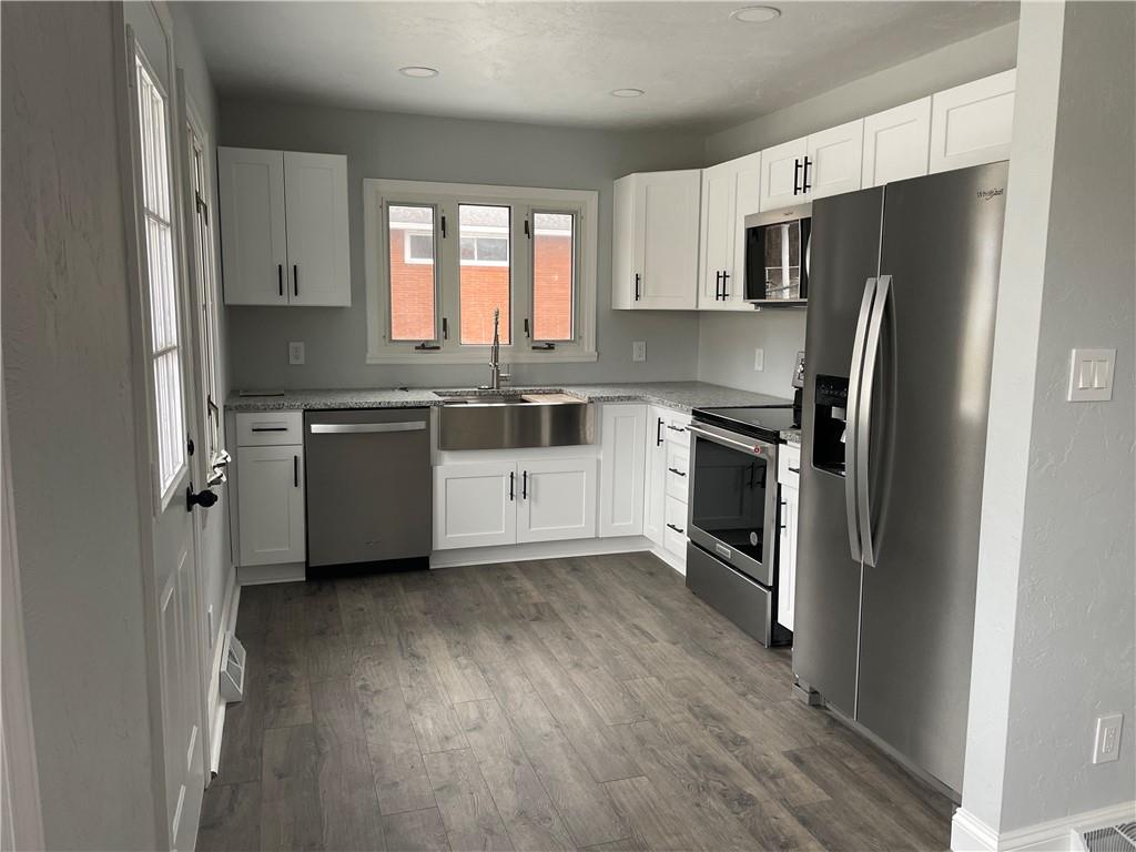 816 High Street Hiller, PA 15444 - Photo 2 of 21 a kitchen with stainless steel appliances a refrigerator sink and microwave