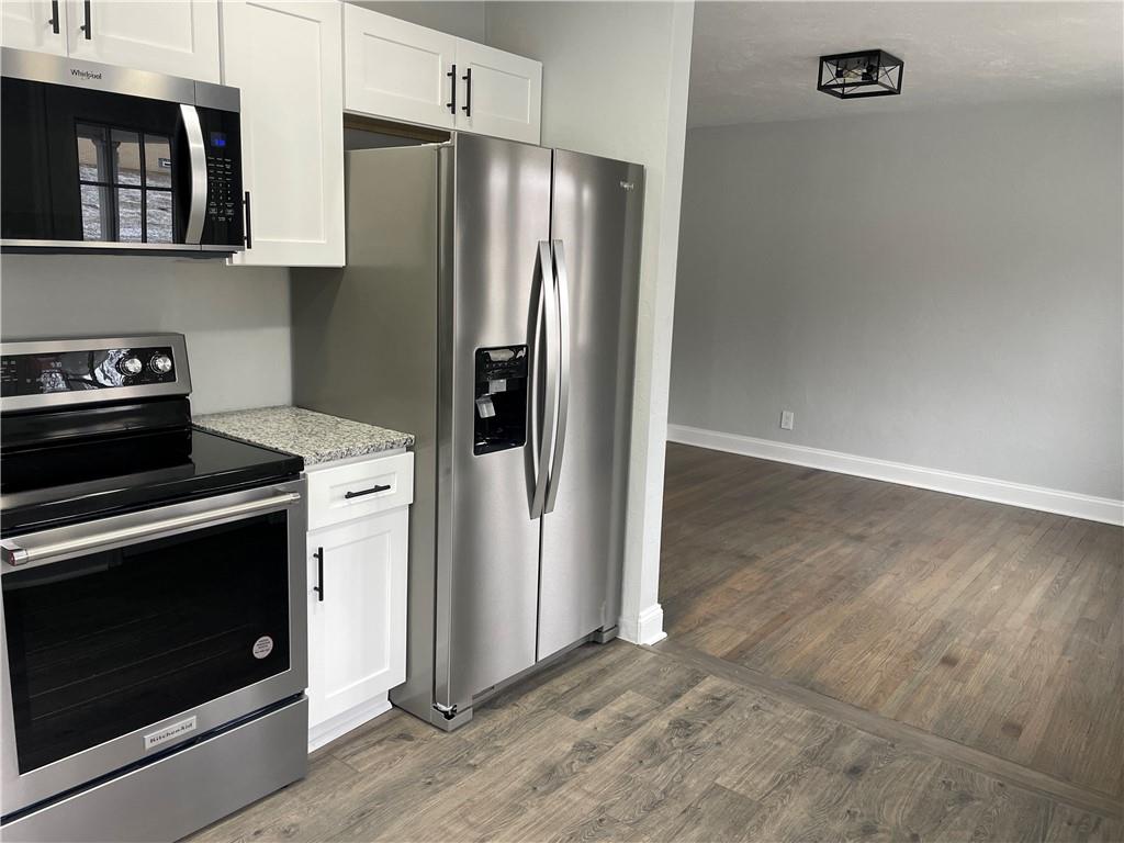 816 High Street Hiller, PA 15444 - Photo 4 of 21 a kitchen with metallic refrigerator and stove