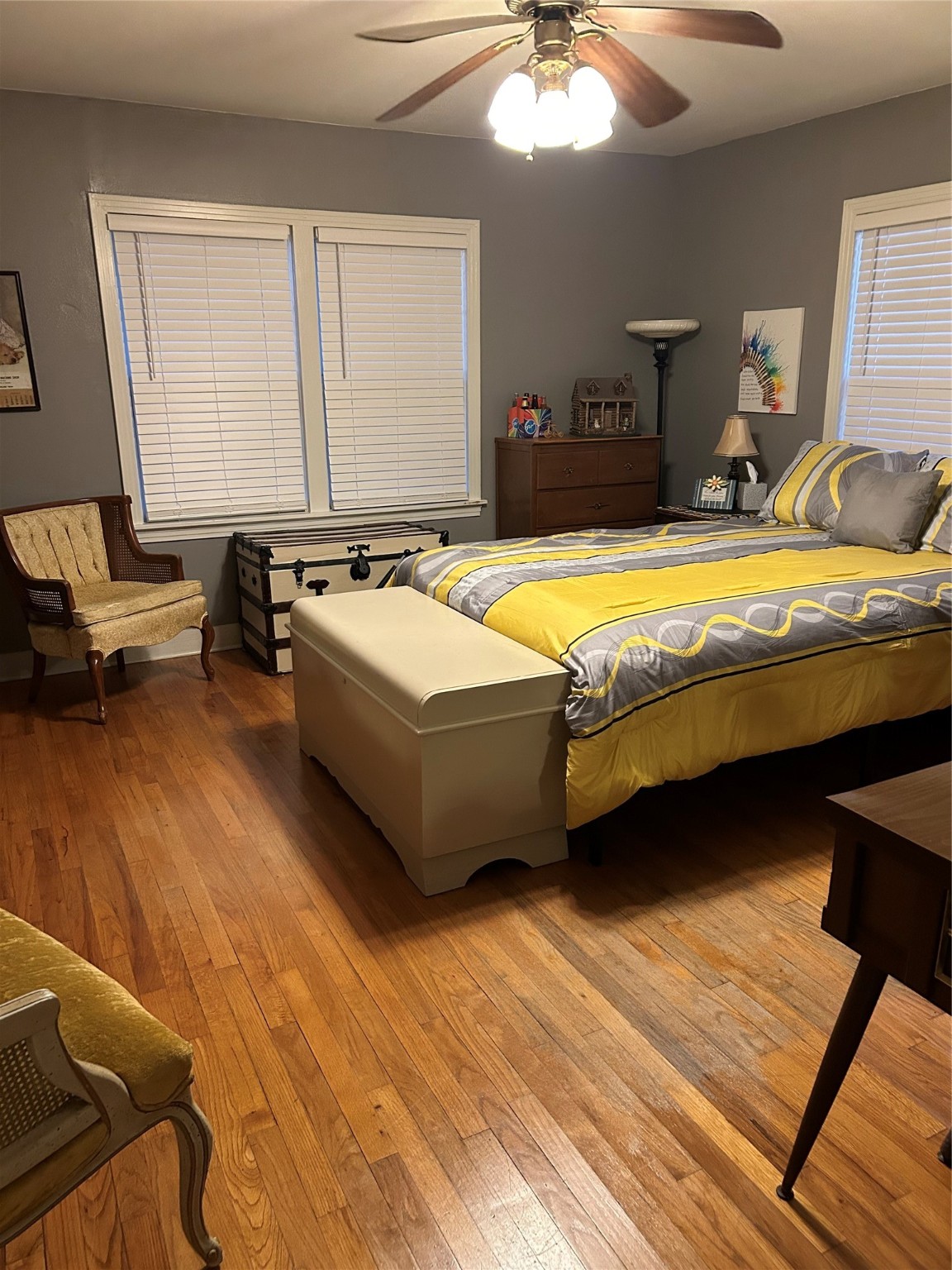 359 Salmon Lake Road Grapeland, TX 75844 - Photo 18 of 49 a spacious bedroom with a bed and a chandelier