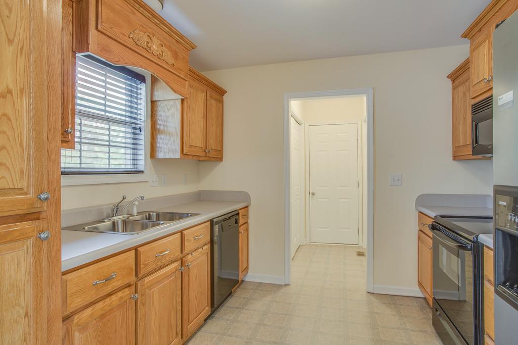 3424 Clegg Drive Spring Hill, TN 37174 - Photo 12 of 28 a spacious bathroom with a granite countertop sink and a washing machine