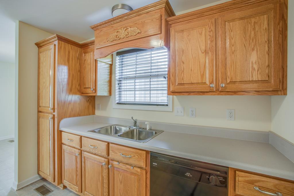 3424 Clegg Drive Spring Hill, TN 37174 - Photo 14 of 28 a kitchen with a sink cabinets and a window