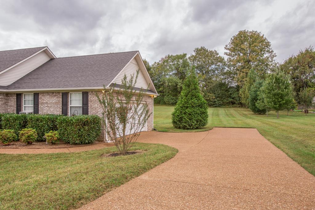 3424 Clegg Drive Spring Hill, TN 37174 - Photo 3 of 28 a front view of a house with yard and green space