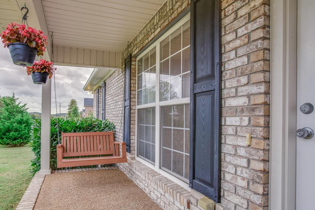3424 Clegg Drive Spring Hill, TN 37174 - Photo 6 of 28 a view of a porch with a flower garden