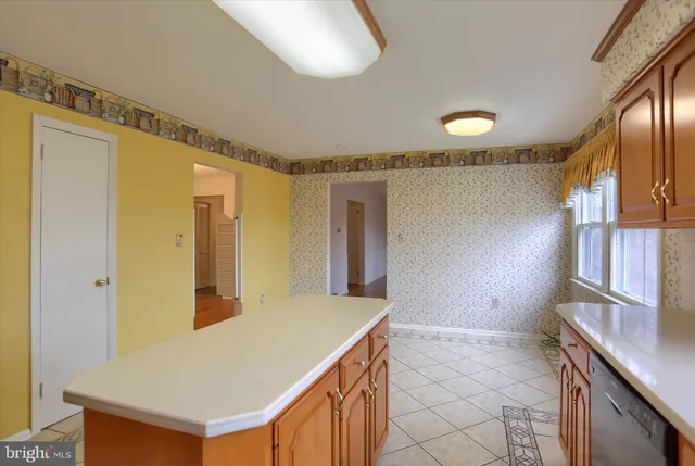 a view of kitchen with cabinets and wooden floor