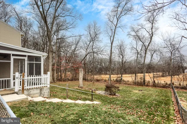 a view of a yard with a house and garden
