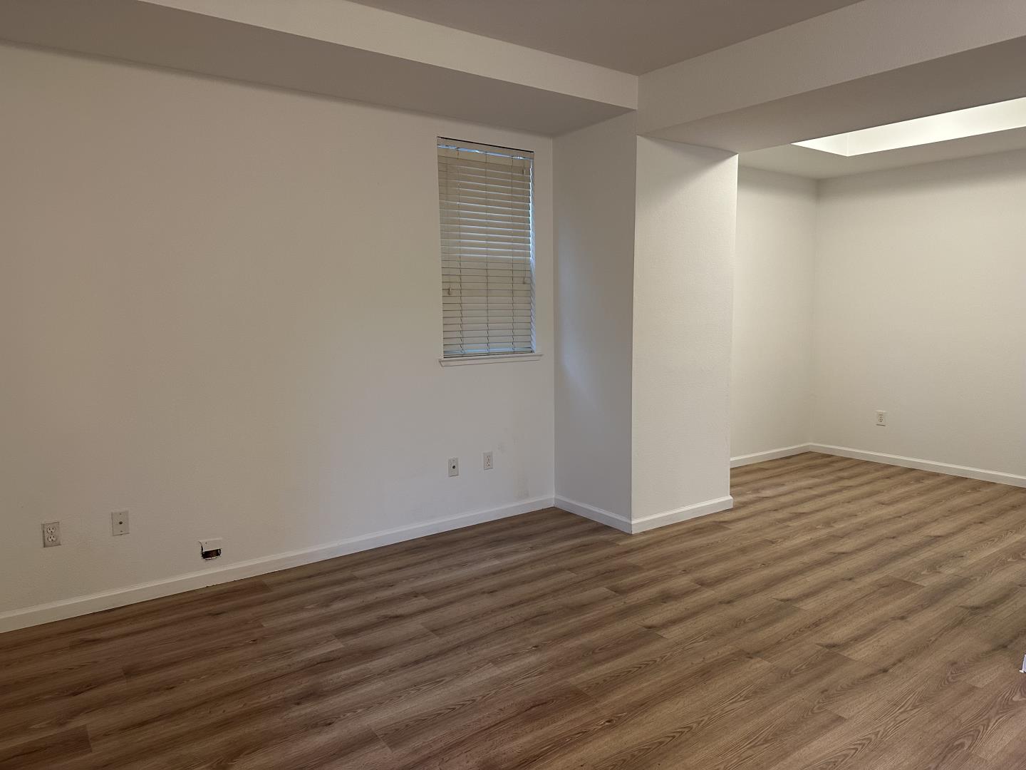 225 Pacifica Boulevard, Unit 101 Watsonville, CA 95076 - Photo 5 of 9 a view of empty room with wooden floor