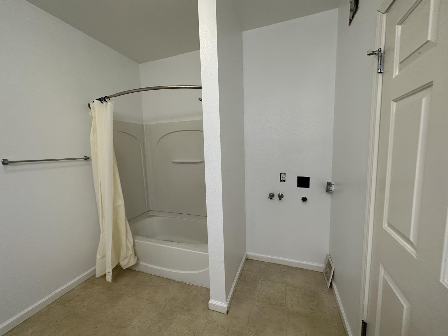 225 Pacifica Boulevard, Unit 101 Watsonville, CA 95076 - Photo 8 of 9 a bathroom with a glass shower door