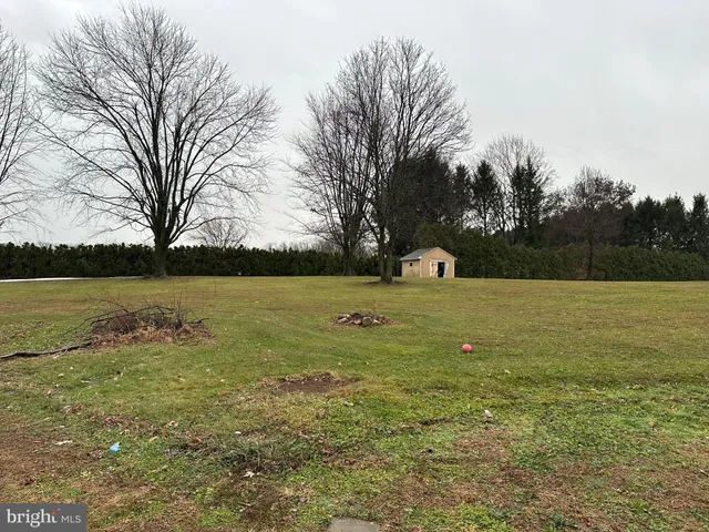 a view of a lake with a yard