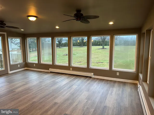 a view of room window and wooden floor