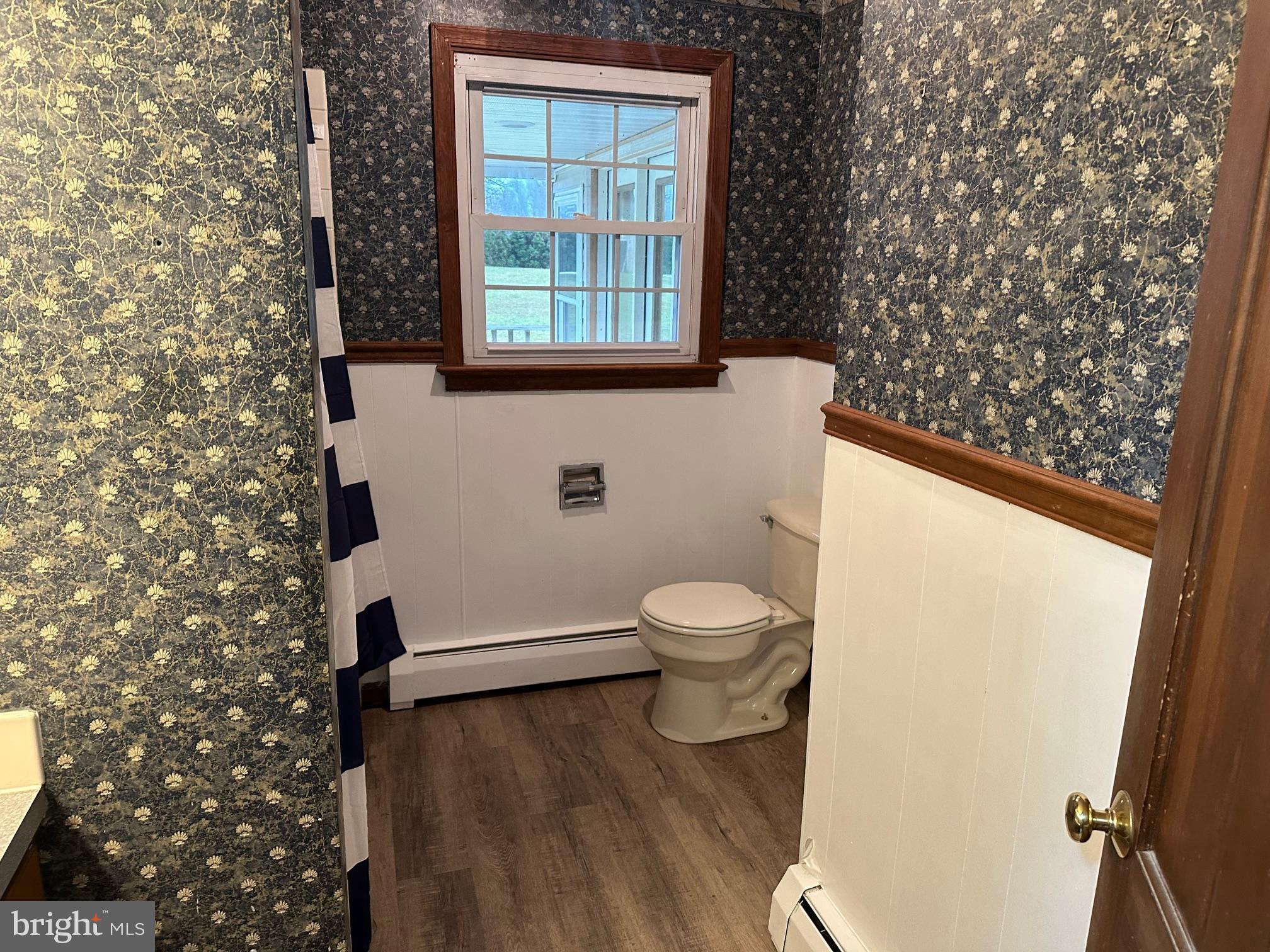 2562 Long Lebanon, PA 17046 - Photo 6 of 16 a white toilet sitting next to a window