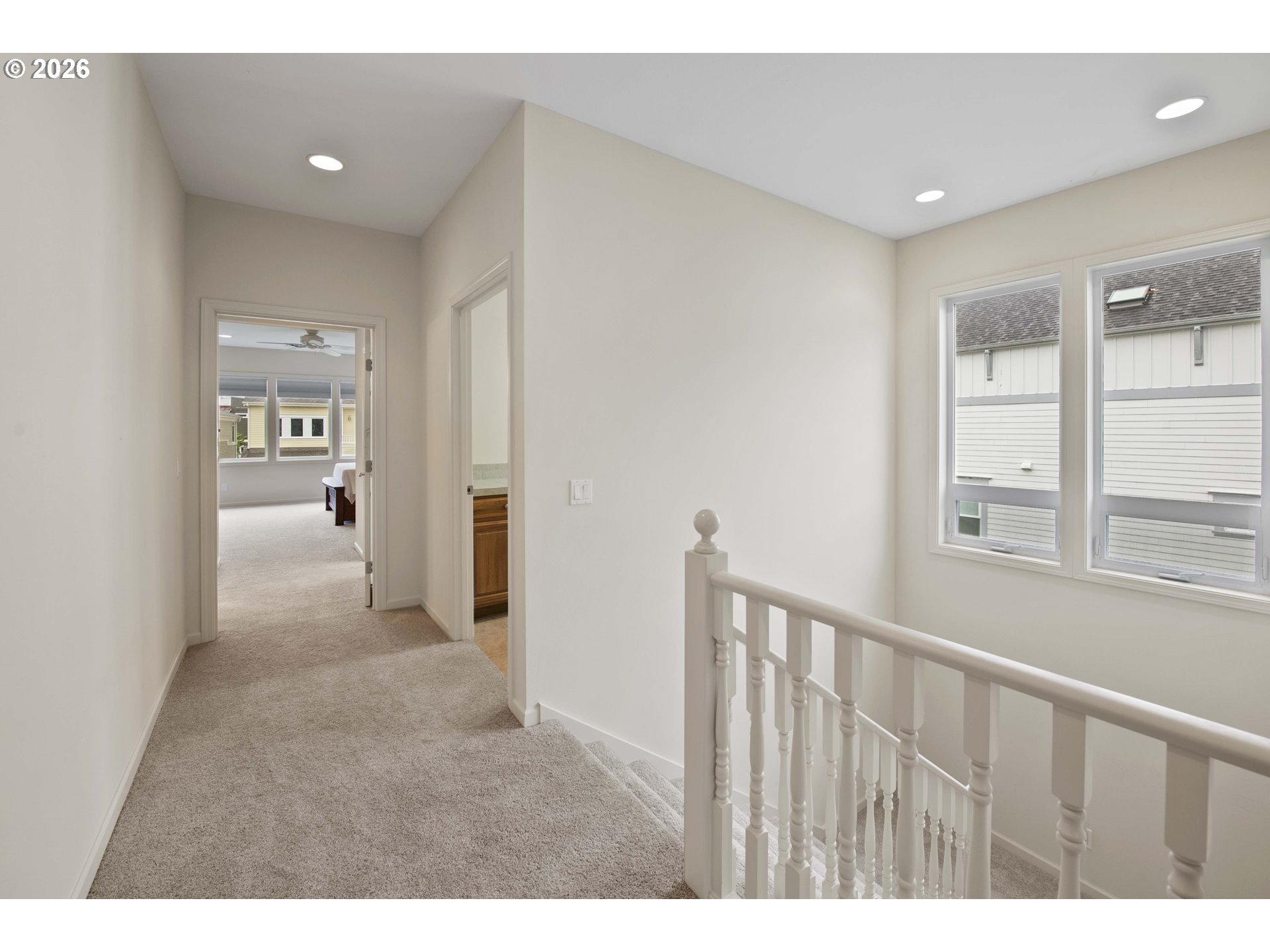 230 Round House Road Astoria, OR 97103 - Photo 19 of 43 a view of a hallway with wooden floor and windows