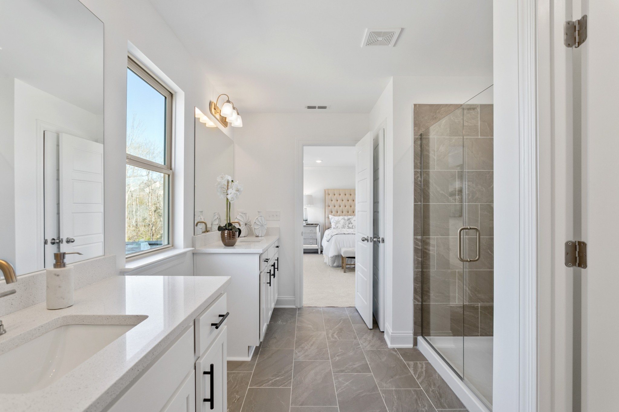 1104 Riverview Run Madison, TN 37115 - Photo 36 of 55 a large white bathroom with a granite countertop shower a sink and a large mirror
