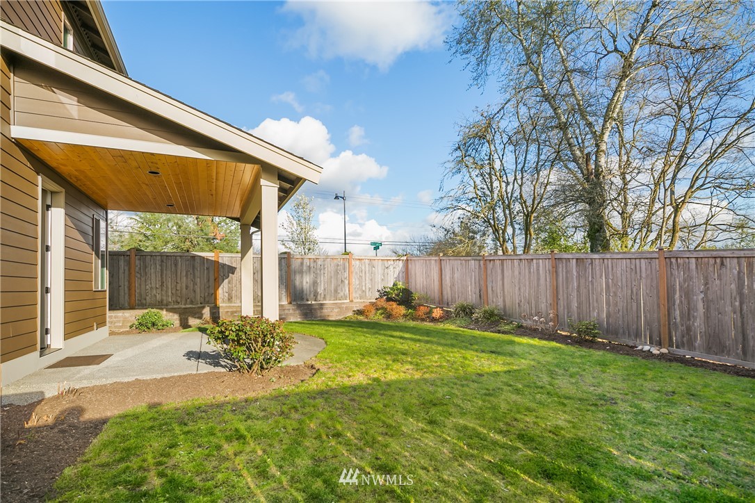 5639 Northeast 7th Place Renton, WA 98059 - Photo 12 of 23 a backyard of a house with table and chairs