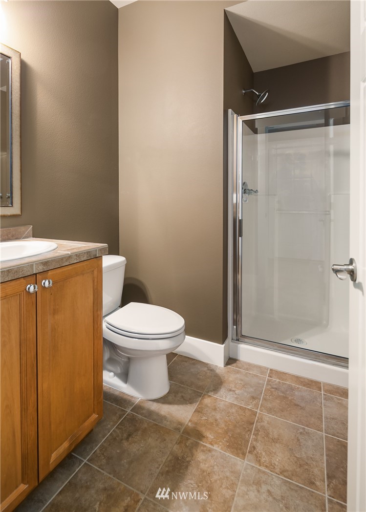 5639 Northeast 7th Place Renton, WA 98059 - Photo 14 of 23 a bathroom with a toilet and a shower