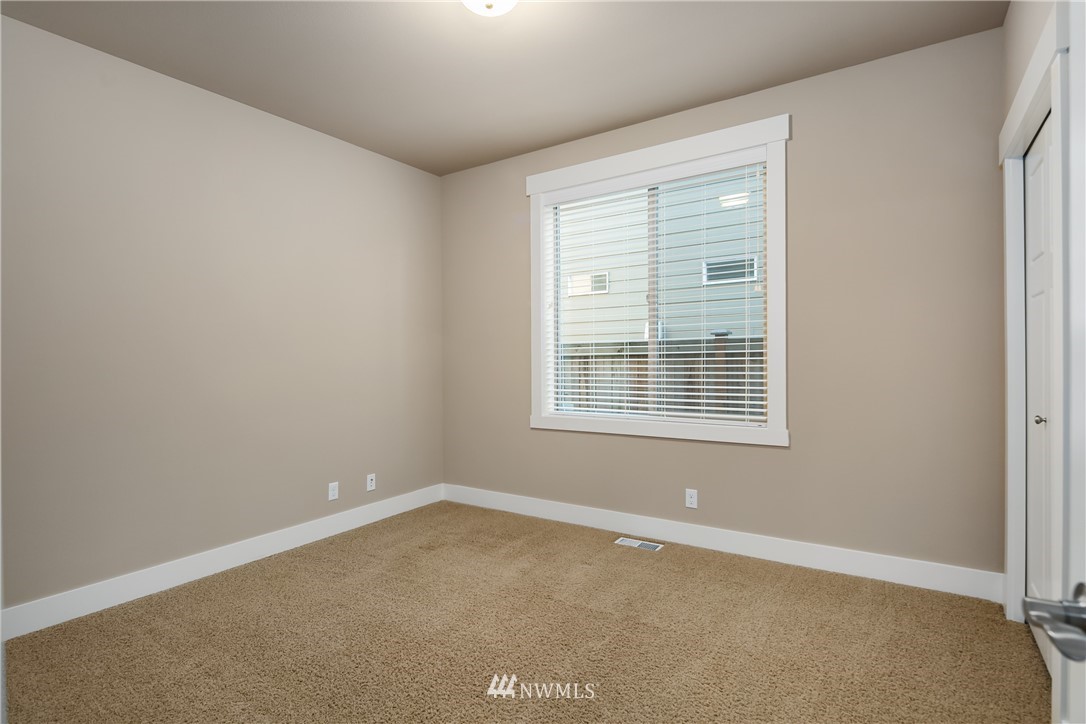 5639 Northeast 7th Place Renton, WA 98059 - Photo 15 of 23 an empty room with a window