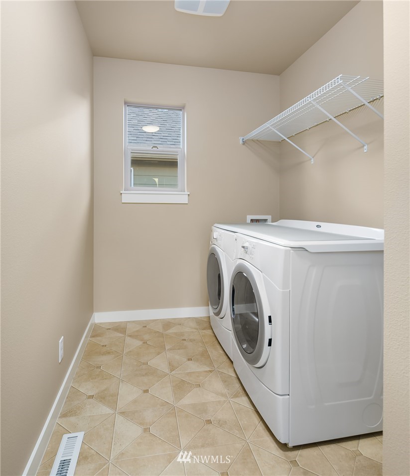 5639 Northeast 7th Place Renton, WA 98059 - Photo 18 of 23 a utility room with dryer and washer