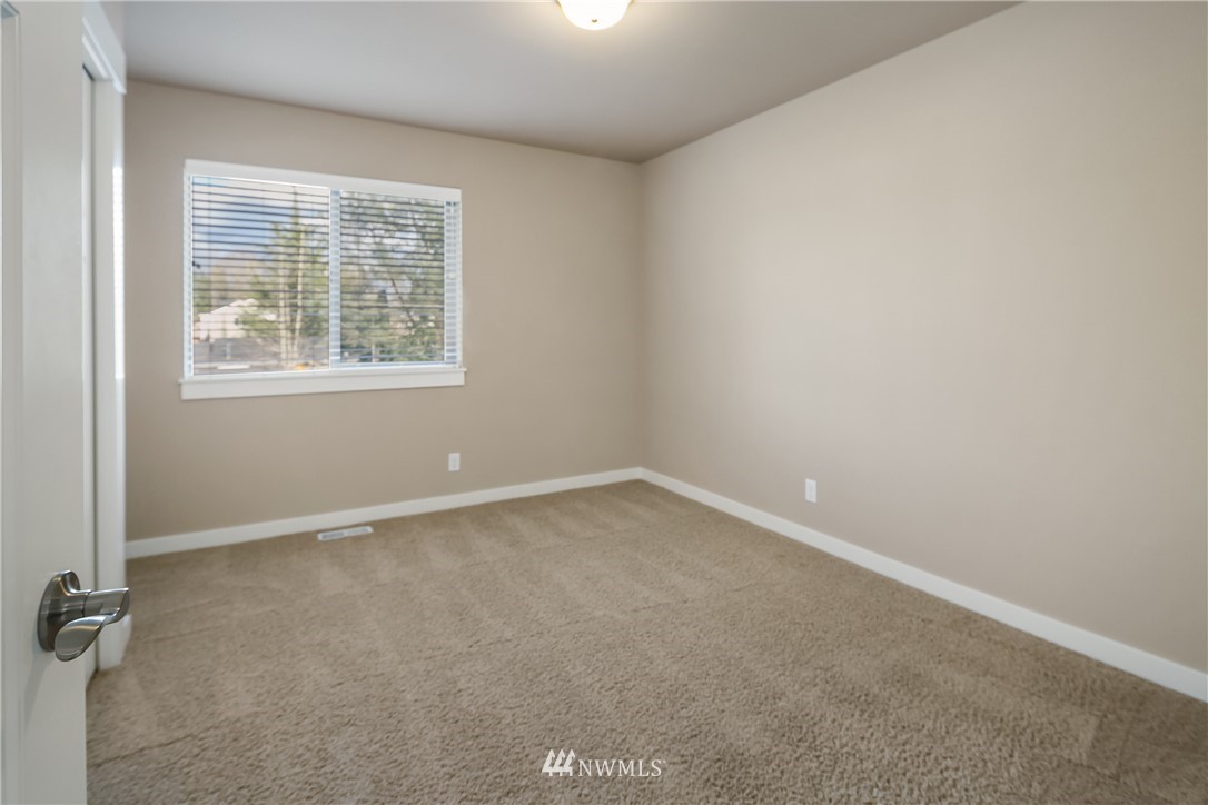 5639 Northeast 7th Place Renton, WA 98059 - Photo 20 of 23 an empty room with a window