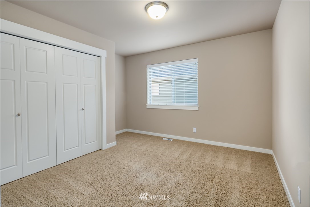 5639 Northeast 7th Place Renton, WA 98059 - Photo 21 of 23 an empty room with windows