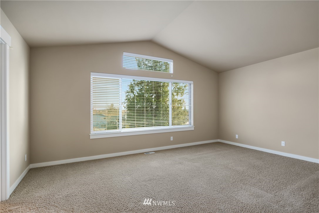 5639 Northeast 7th Place Renton, WA 98059 - Photo 22 of 23 an empty room with a window