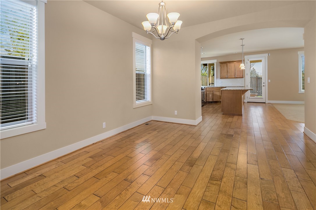 5639 Northeast 7th Place Renton, WA 98059 - Photo 5 of 23 a view of a livingroom with a chandelier