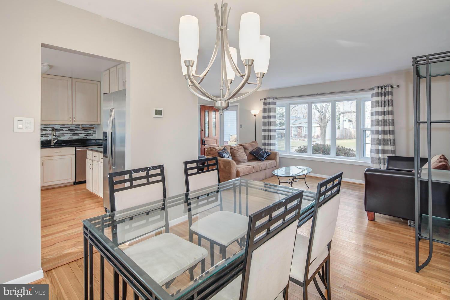 4106 Delancy Drive Silver Spring, MD 20906 - Photo 7 of 30 a view of a dining room with furniture window and wooden floor