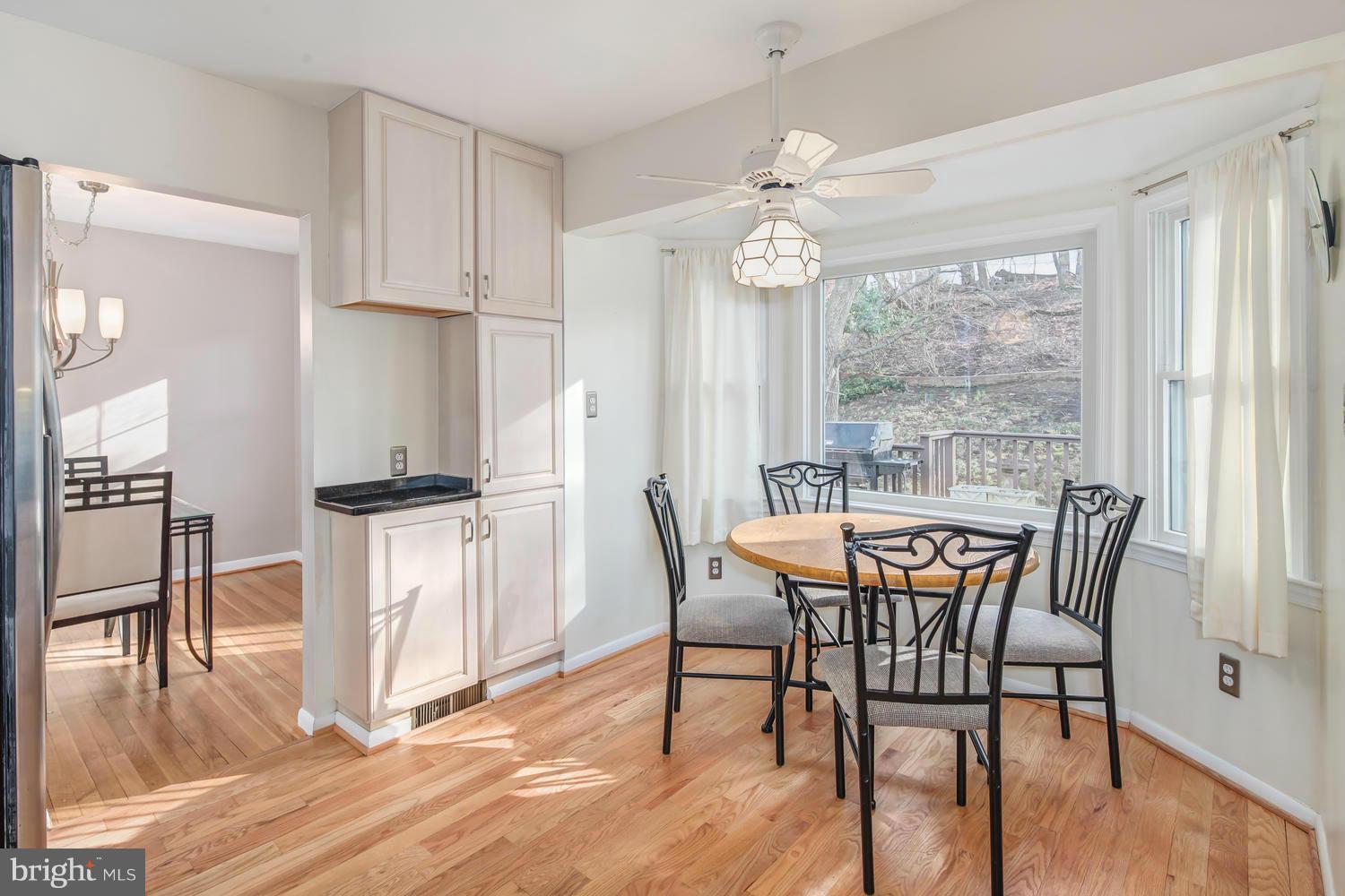 4106 Delancy Drive Silver Spring, MD 20906 - Photo 8 of 30 a view of a dining room with furniture window and wooden floor