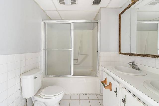W4019 Black Point Road Lake Geneva, WI 53147 - Photo 13 of 23 a bathroom with a sink toilet and shower