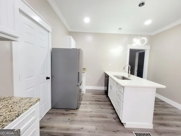 a kitchen with a refrigerator and countertop