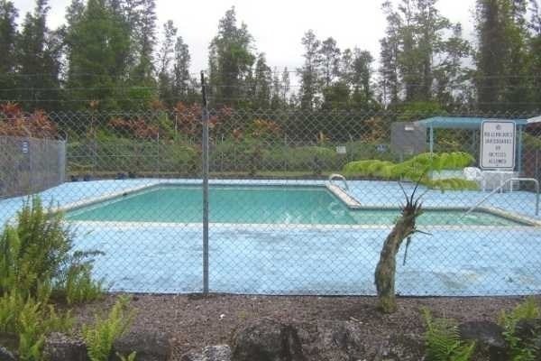 Seaview Road Pahoa, HI 96778 - Photo 7 of 7 a backyard of a house with a yard and outdoor seating