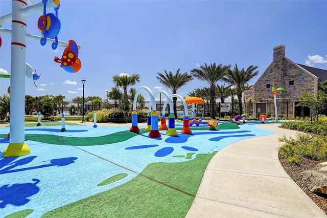 a childrens park with lots of swings and slides