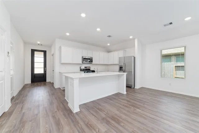 a view of kitchen with wooden floor