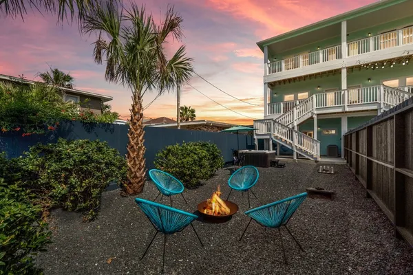 a view of a backyard with plants and a patio