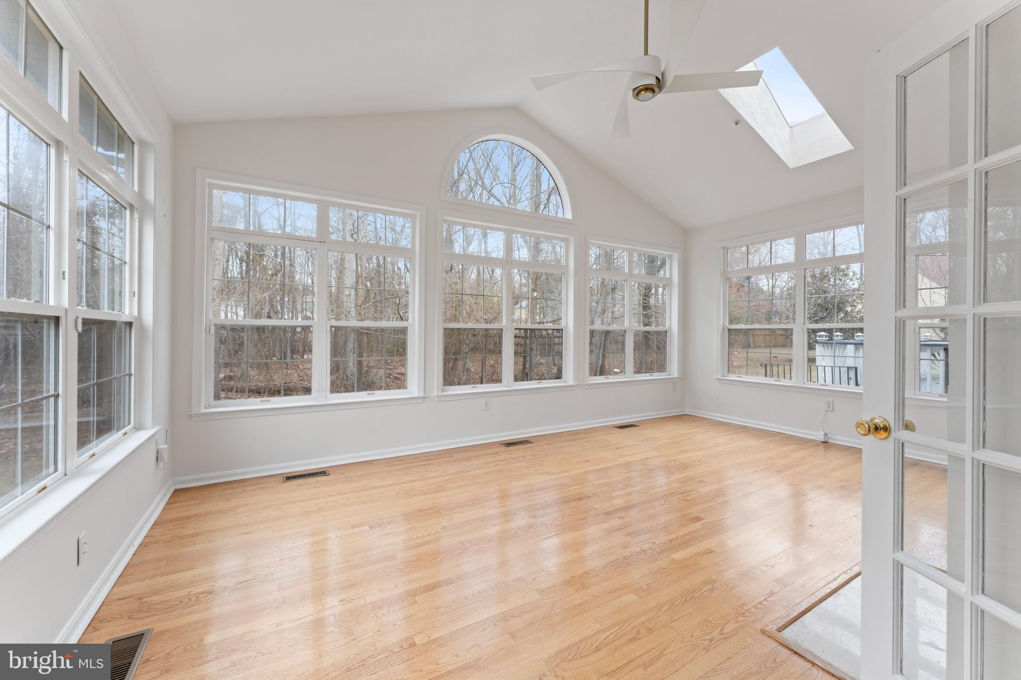 10110 Goose Pond Court Laurel, MD 20708 - Photo 11 of 46 a view of an empty room with a window and wooden floor