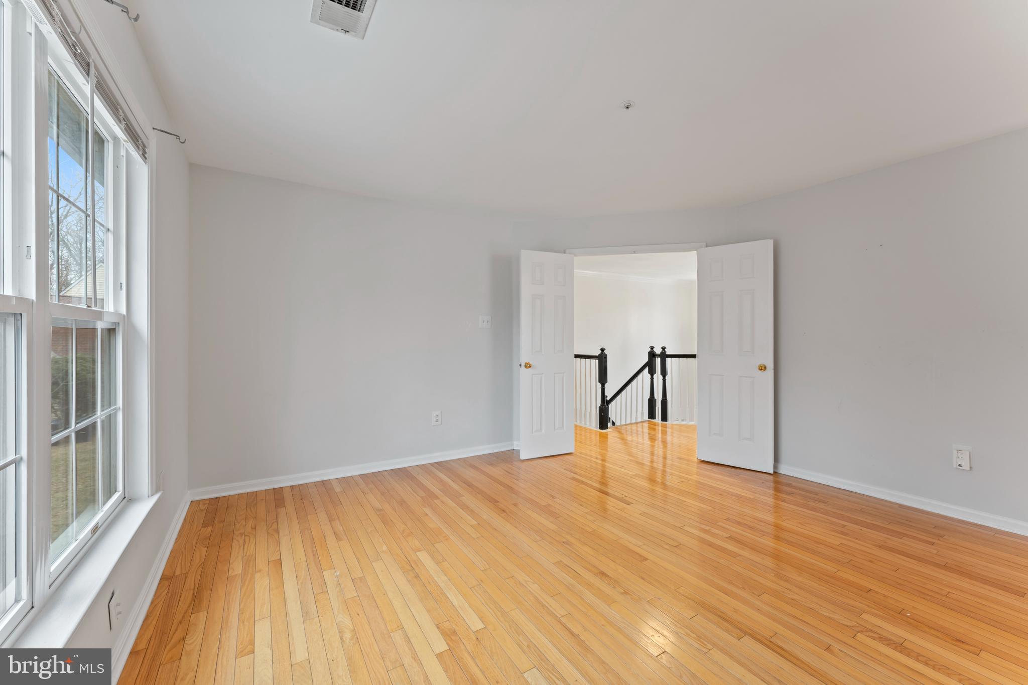 10110 Goose Pond Court Laurel, MD 20708 - Photo 30 of 46 a view of empty room with wooden floor