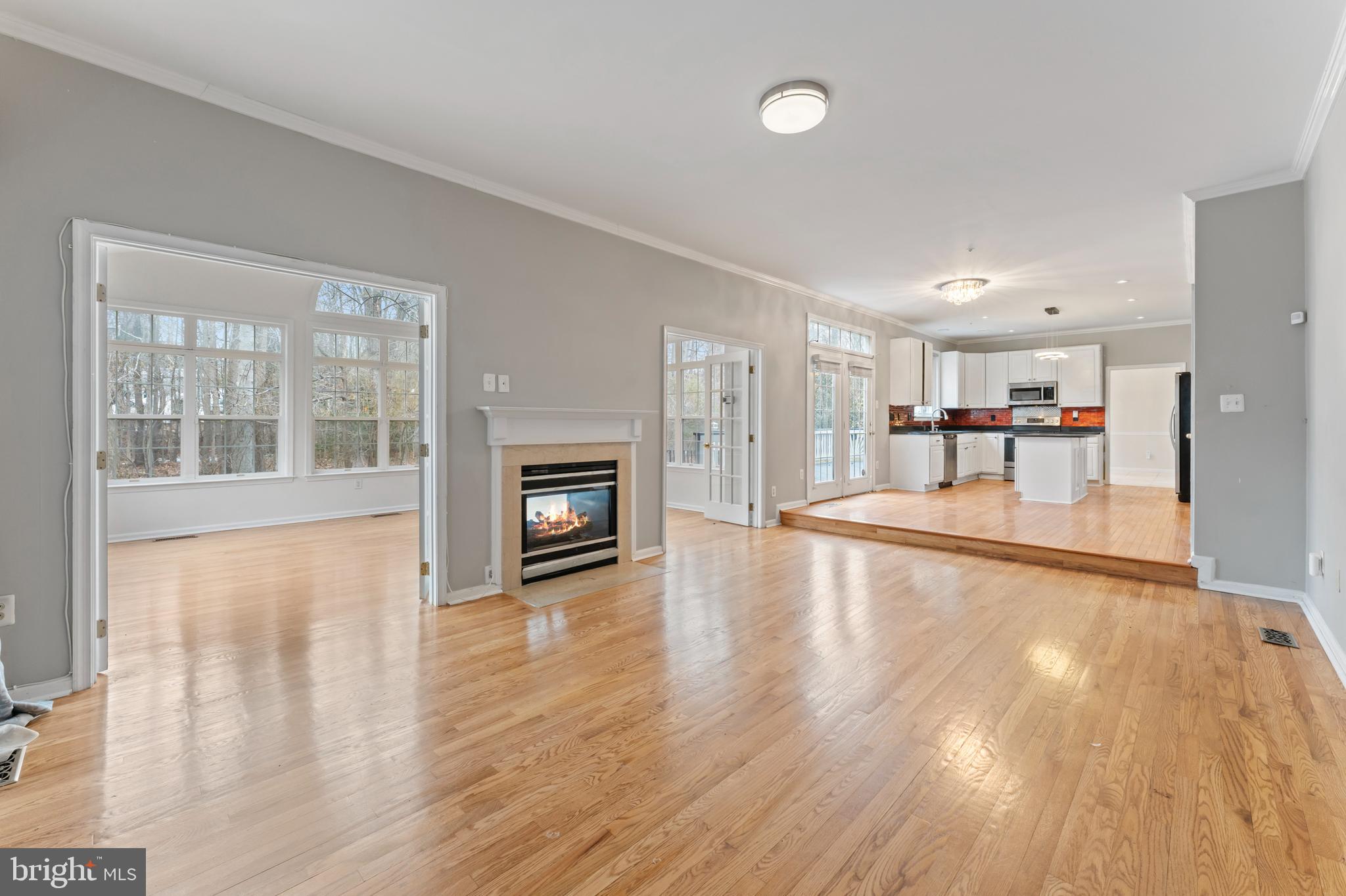 10110 Goose Pond Court Laurel, MD 20708 - Photo 10 of 46 a view of empty room with wooden floor and fireplace