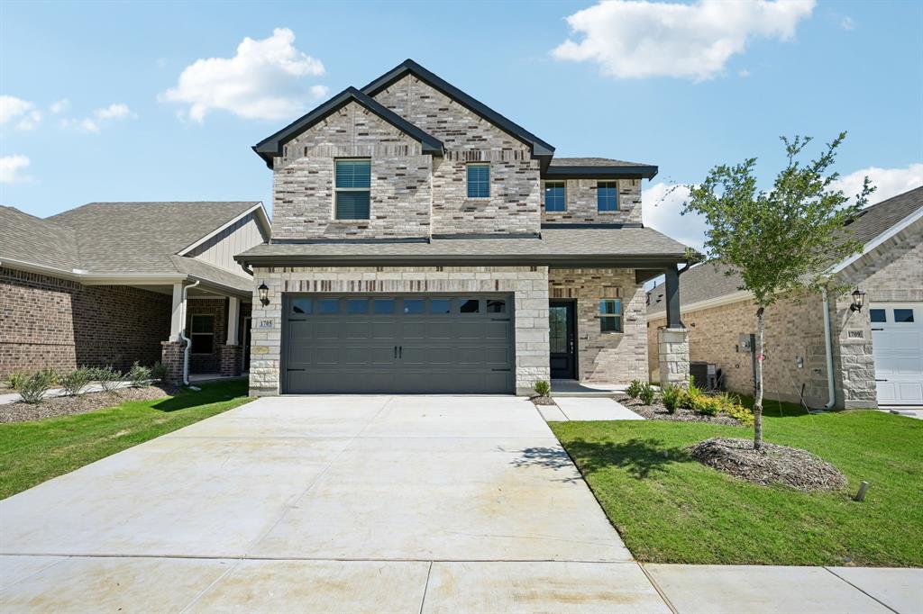 1705 Arches Road Anna, TX 75409 - Photo 1 of 33 a front view of a house with a yard and garage