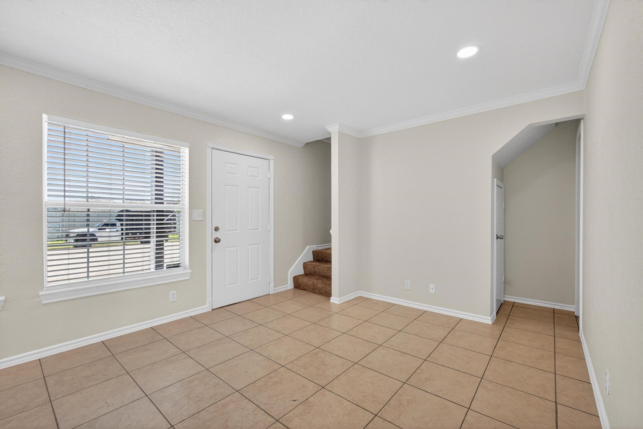 1221 Cedar Post Lane, Unit 1D Houston, TX 77055 - Photo 3 of 24 a view of an empty room with a window