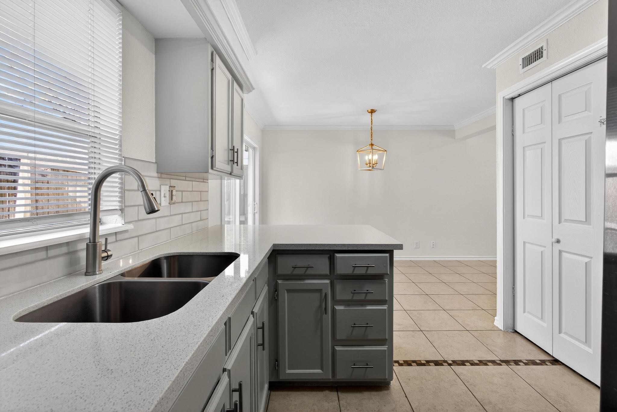 1221 Cedar Post Lane, Unit 1D Houston, TX 77055 - Photo 10 of 24 a kitchen with a sink and cabinets