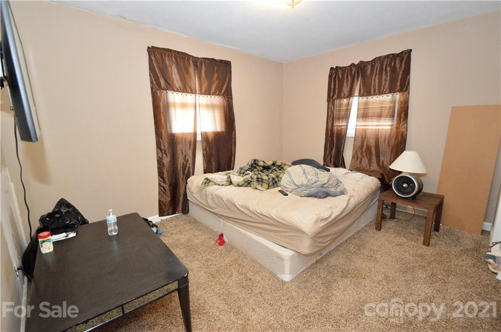 1763 Harris Road Fort Mill, SC 29708 - Photo 14 of 30 a living room with a bed and dresser