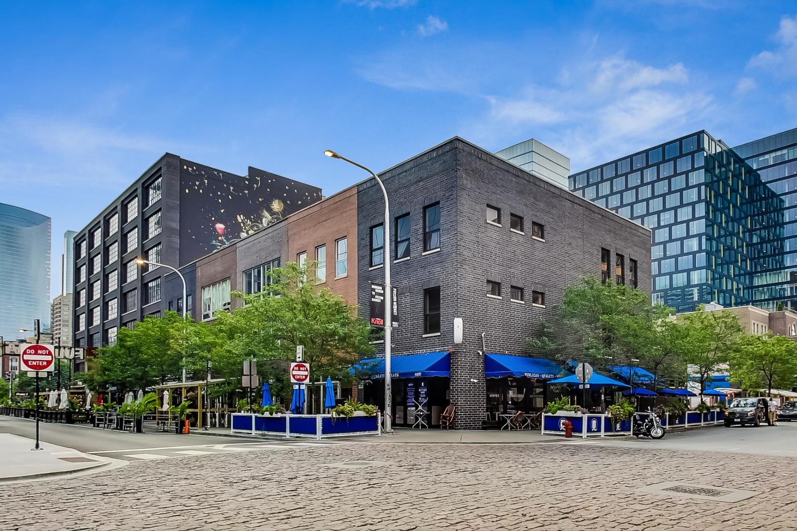 821 West Fulton Market, Unit 2 Chicago, IL 60607 - Photo 2 of 20 a front view of a building with street view