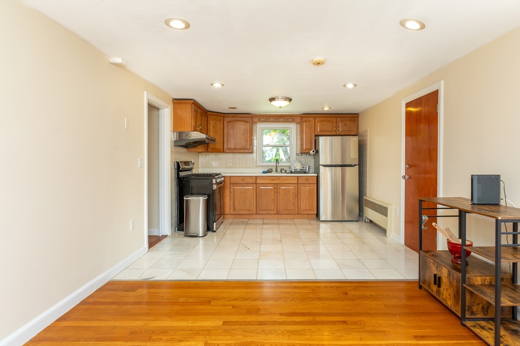 21 Allerton Road Milton, MA 02186 - Photo 11 of 42 a large kitchen with a large counter top appliances and cabinets