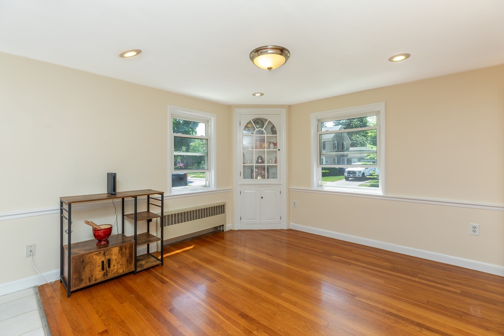 21 Allerton Road Milton, MA 02186 - Photo 12 of 42 wooden floor in an empty room with a window