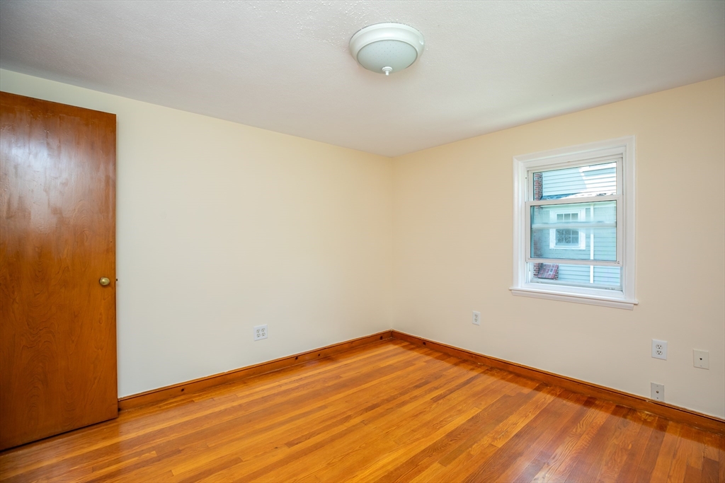 21 Allerton Road Milton, MA 02186 - Photo 24 of 42 a view of empty room with wooden floor