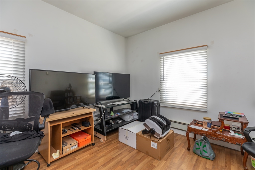 21 Allerton Road Milton, MA 02186 - Photo 27 of 42 a living room with furniture and a flat screen tv