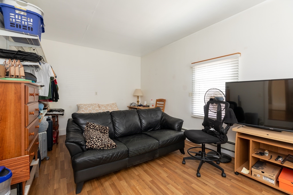 21 Allerton Road Milton, MA 02186 - Photo 28 of 42 a living room with furniture and a flat screen tv