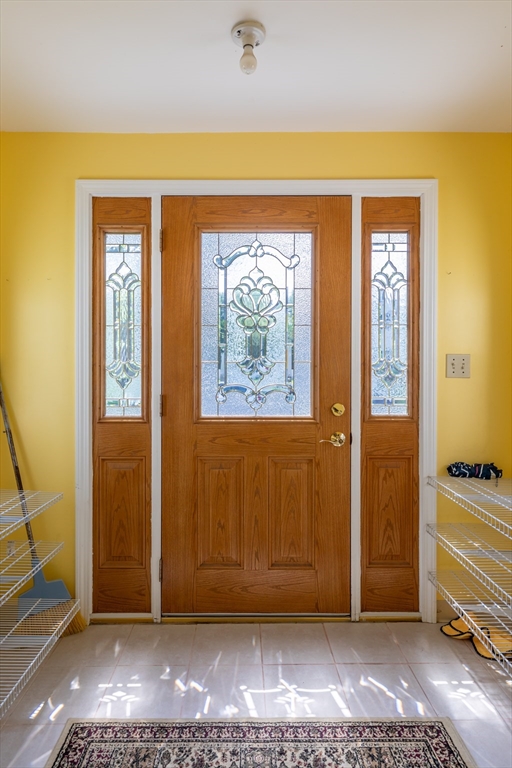 21 Allerton Road Milton, MA 02186 - Photo 31 of 42 a view of front door with wooden floor