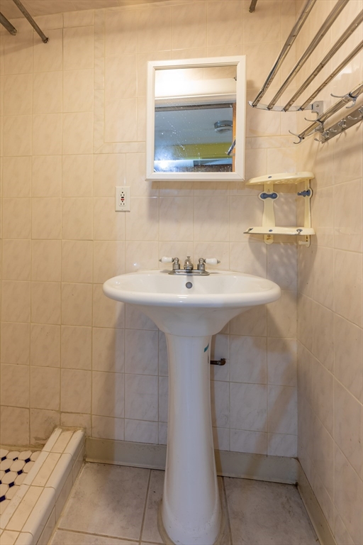 21 Allerton Road Milton, MA 02186 - Photo 32 of 42 a bathroom with a sink a toilet and mirror