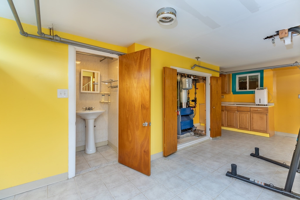 21 Allerton Road Milton, MA 02186 - Photo 36 of 42 a view of a livingroom with furniture and a bathroom